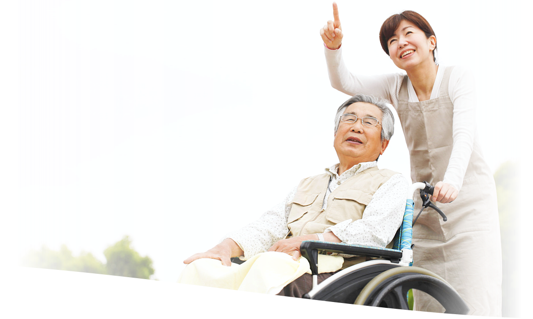 caregiver and elderly man in a wheelchair